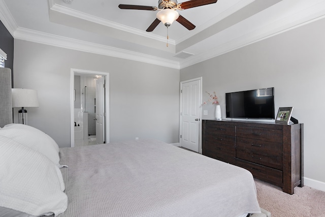 carpeted bedroom with crown molding, connected bathroom, ceiling fan, and a raised ceiling