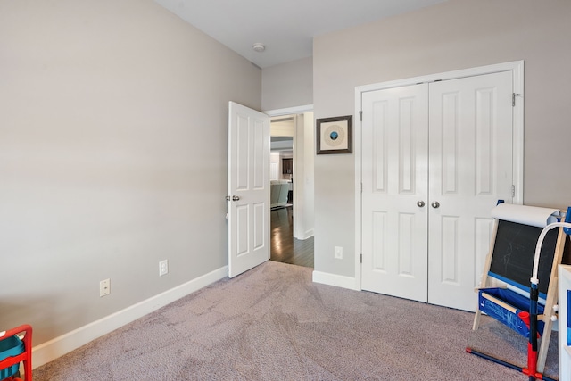 carpeted bedroom with a closet