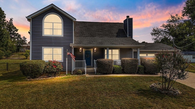 view of front facade featuring a yard and covered porch