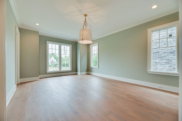 spare room with light hardwood / wood-style flooring and ornamental molding