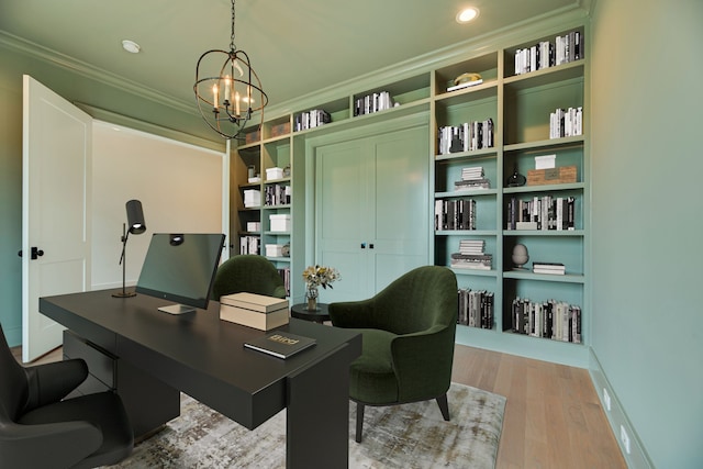 home office featuring ornamental molding, a chandelier, and light hardwood / wood-style floors