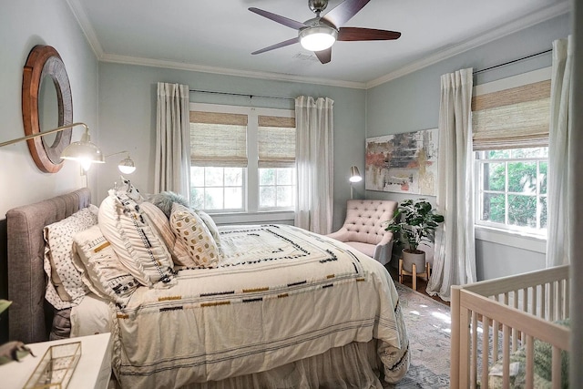 bedroom featuring multiple windows, ornamental molding, and ceiling fan