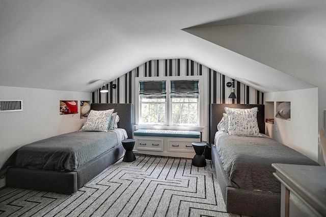 bedroom featuring carpet flooring and vaulted ceiling