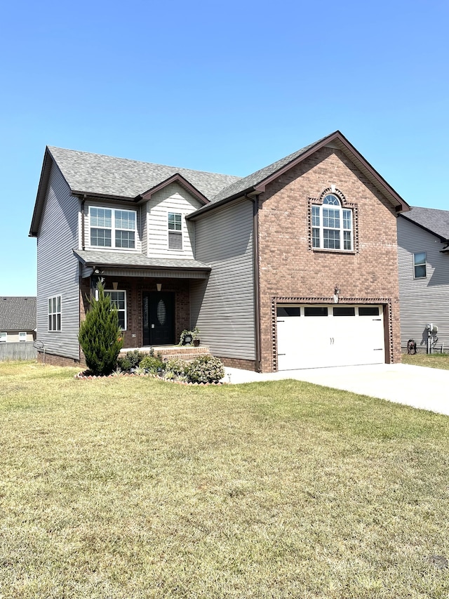 front of property featuring a garage and a front lawn