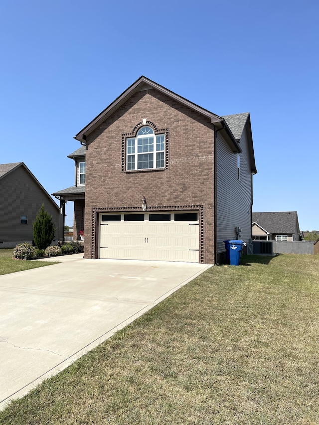 view of side of home featuring a garage and a lawn