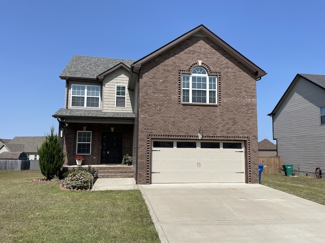 view of front of house with a front yard and a garage