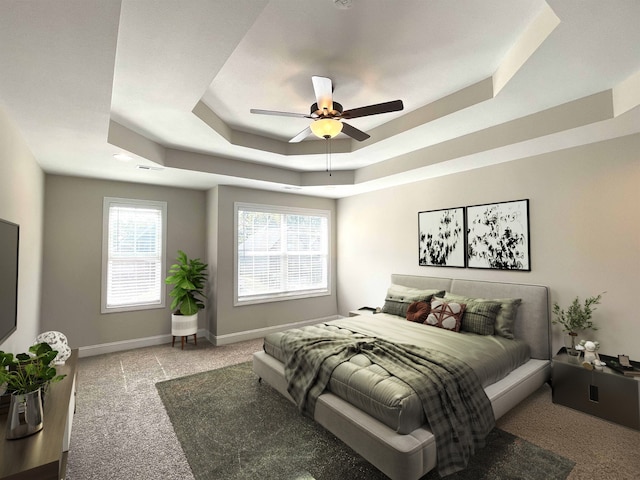 carpeted bedroom with ceiling fan and a raised ceiling