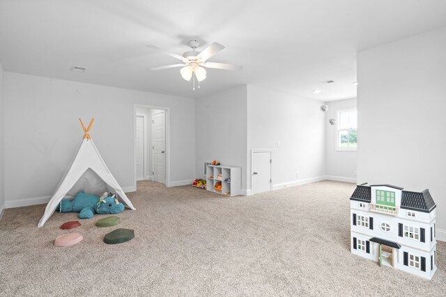 playroom with ceiling fan and carpet flooring