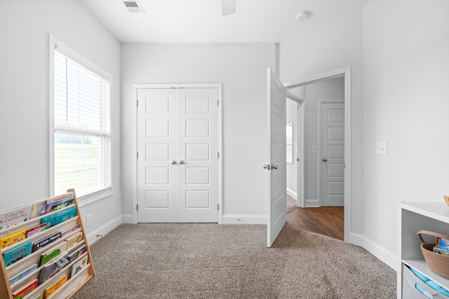 rec room featuring carpet flooring and ceiling fan