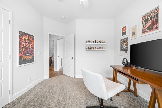 carpeted office with ceiling fan