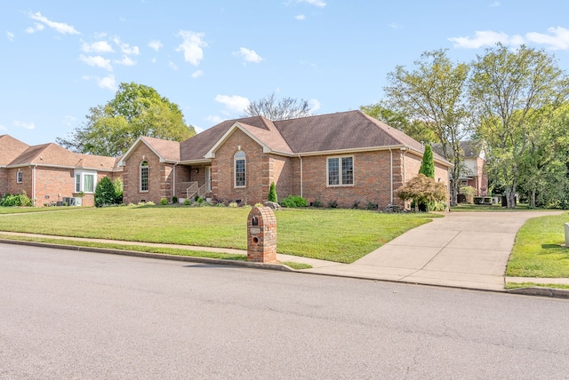 ranch-style house featuring a front lawn