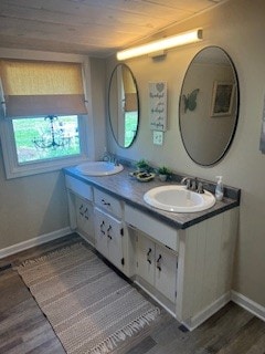 bathroom with vanity and hardwood / wood-style floors