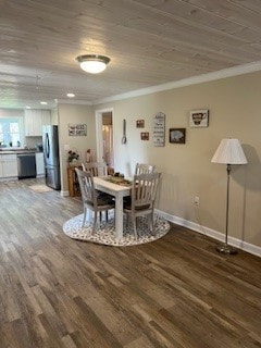 dining space with wood-type flooring and crown molding