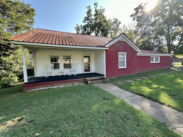 view of front of property with a front lawn and a porch