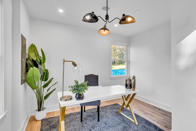 office area with hardwood / wood-style floors