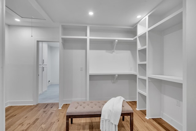 walk in closet featuring light hardwood / wood-style floors