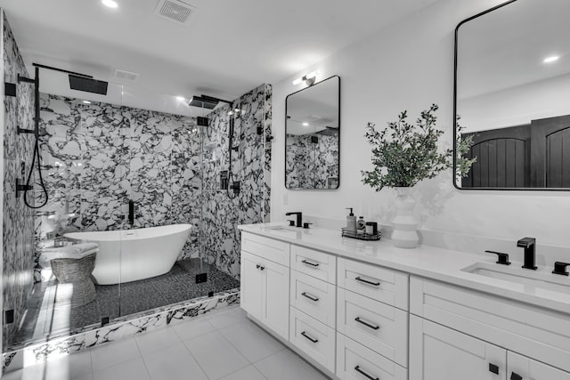 bathroom featuring tile patterned floors, vanity, tile walls, and shower with separate bathtub