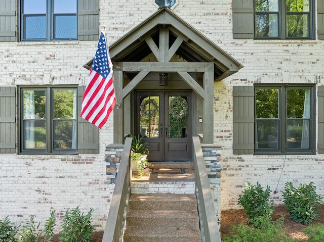 view of exterior entry featuring french doors