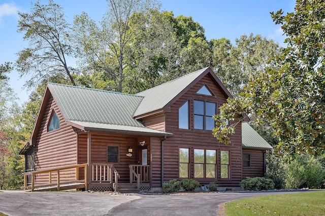 log cabin featuring a porch