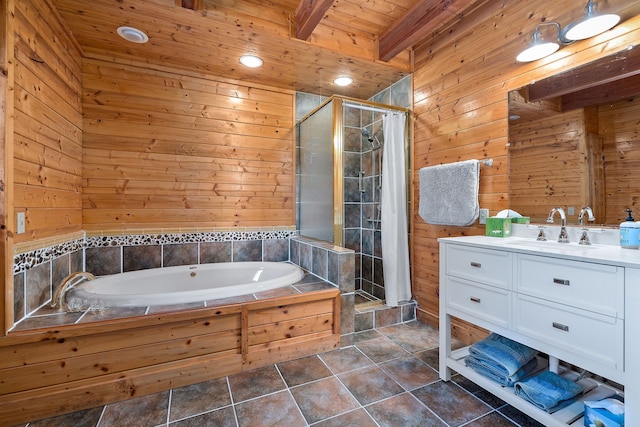 bathroom featuring plus walk in shower, beam ceiling, tile patterned floors, wooden walls, and vanity