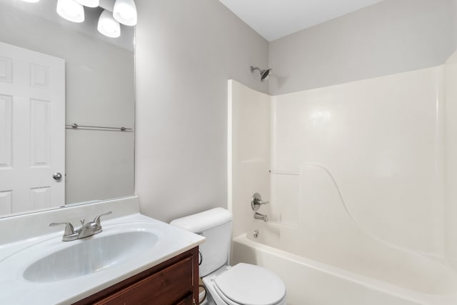 full bathroom featuring vanity, tub / shower combination, and toilet