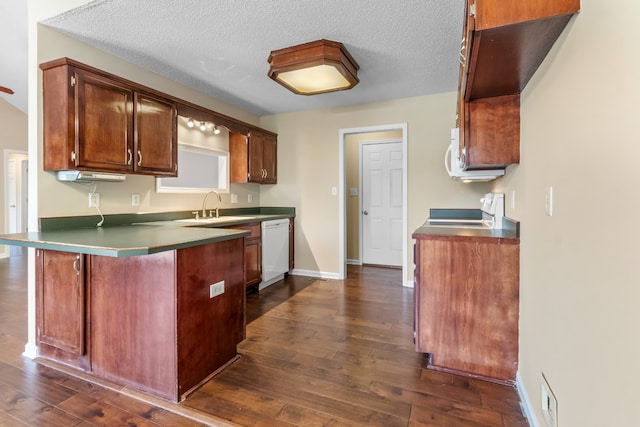 kitchen with dishwasher, a textured ceiling, dark hardwood / wood-style floors, range, and kitchen peninsula