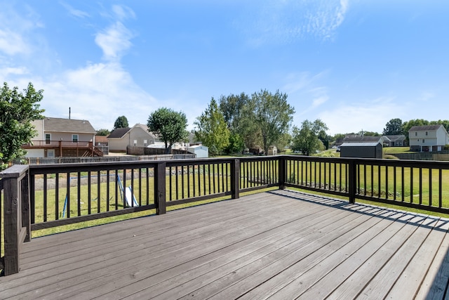 wooden deck with a lawn