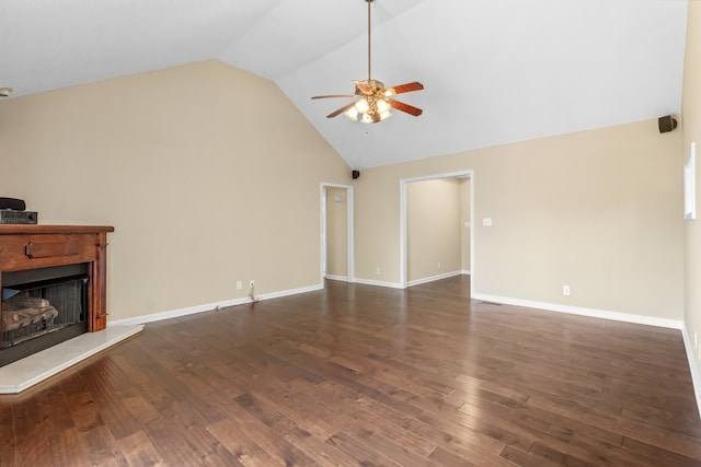 unfurnished living room featuring ceiling fan, vaulted ceiling, and dark wood-type flooring