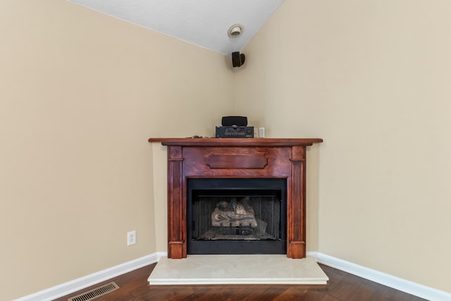 room details featuring a textured ceiling and wood-type flooring