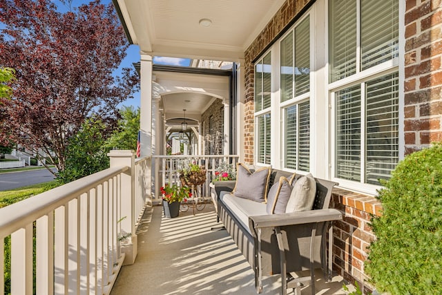 balcony featuring covered porch