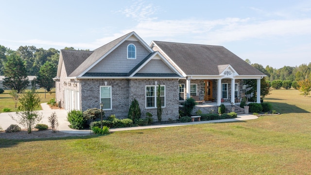 craftsman-style home featuring a garage and a front lawn