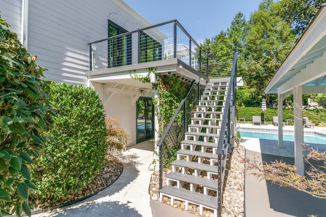 view of patio featuring a balcony