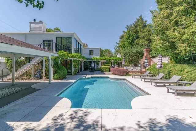 view of pool featuring a patio