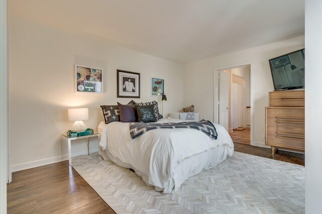 bedroom with wood-type flooring