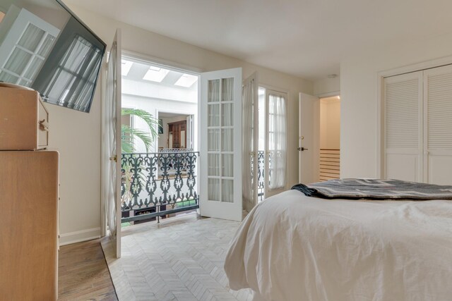 bedroom featuring light hardwood / wood-style flooring and a closet