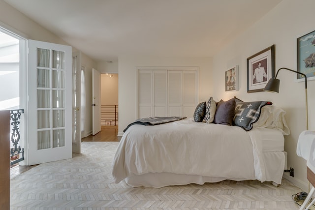 bedroom with light hardwood / wood-style flooring and a closet