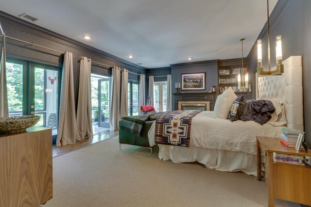 bedroom with crown molding and hardwood / wood-style floors