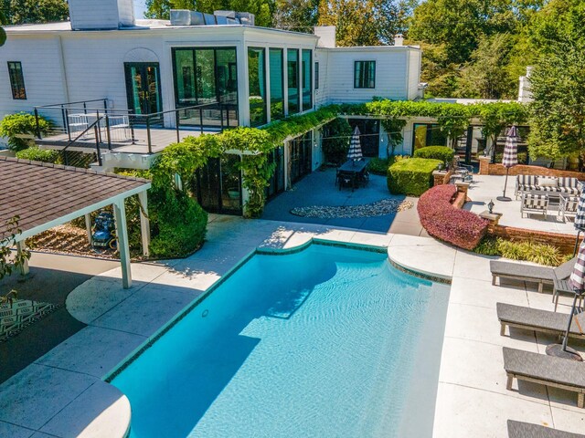 view of pool featuring a patio area