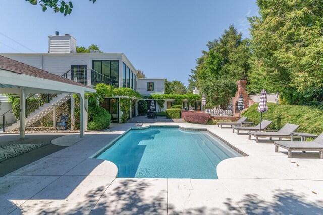 view of pool featuring a patio area