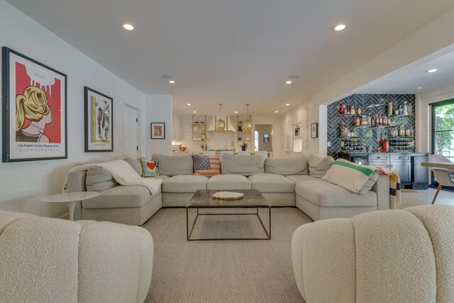 living room featuring indoor bar