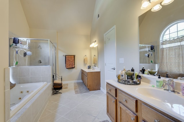 bathroom featuring tile patterned floors, vaulted ceiling, vanity, and independent shower and bath