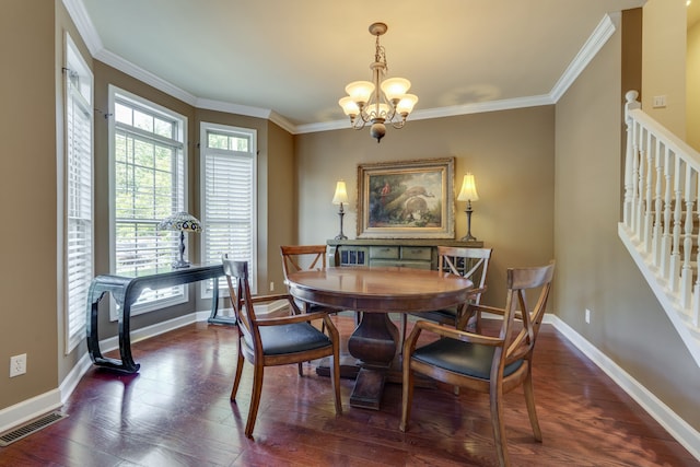 dining area featuring a notable chandelier, crown molding, and dark wood-type flooring