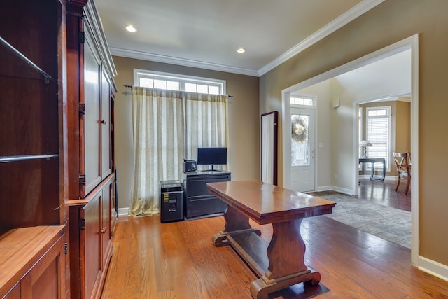 office space featuring ornamental molding and light wood-type flooring