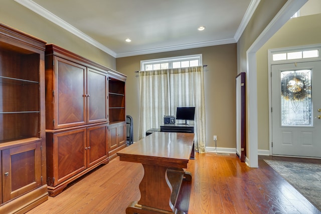 home office featuring light hardwood / wood-style flooring and ornamental molding