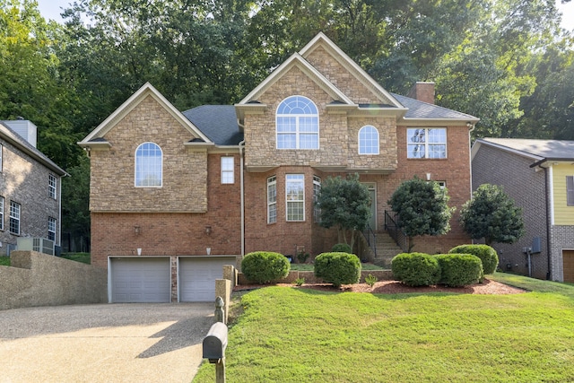 view of front facade with a front lawn and a garage