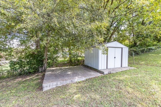 view of outbuilding featuring a yard