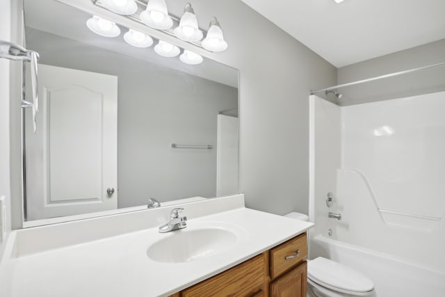 full bathroom with vanity, bathtub / shower combination, and toilet