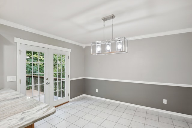 unfurnished dining area featuring crown molding, light tile patterned flooring, and french doors