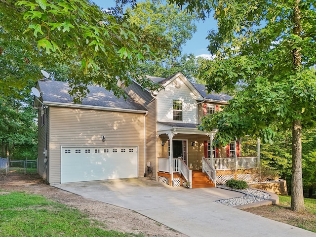 view of front of house featuring a porch and a garage