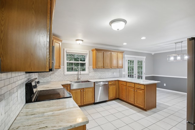 kitchen with appliances with stainless steel finishes, pendant lighting, sink, ornamental molding, and kitchen peninsula